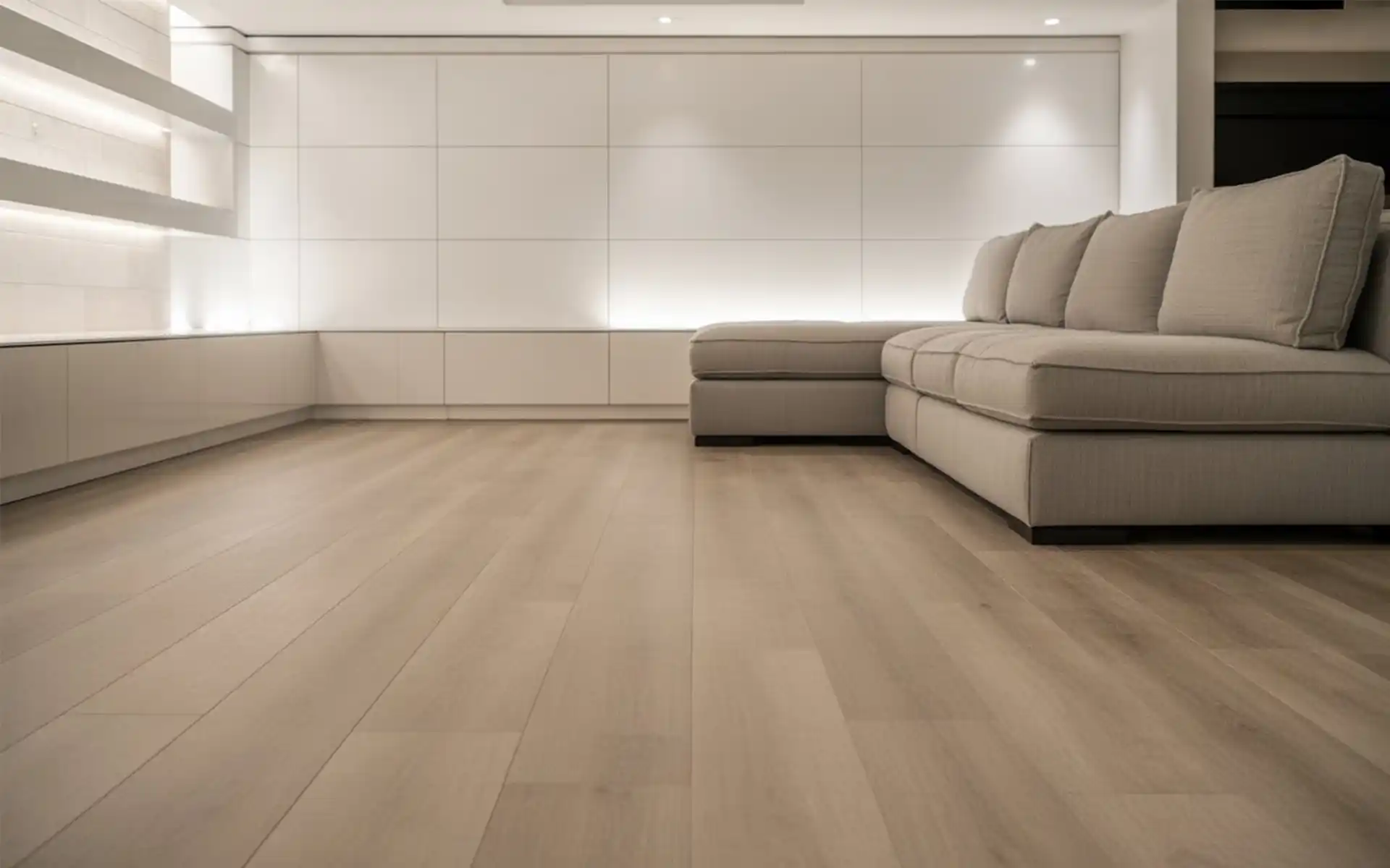 Bright basement living room with neutral decor and soft lighting.