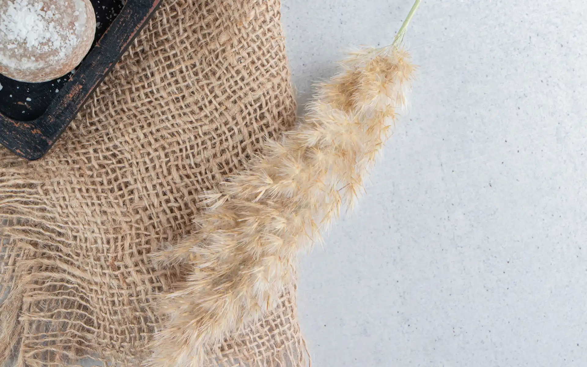 Close-up of burlap, lace, and twine textures for a rustic wedding
