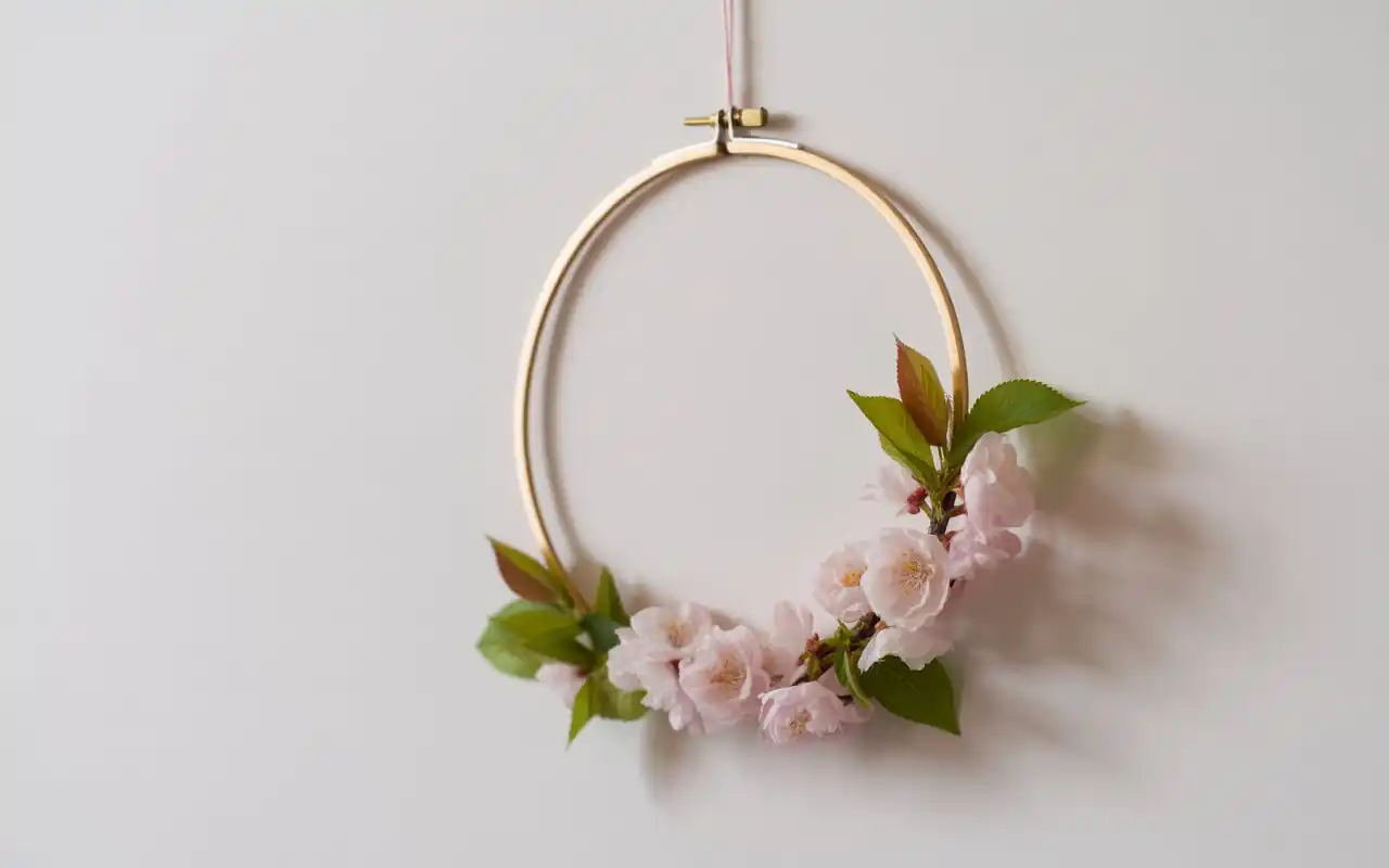 DIY gold hoop wall hanging with pink cherry blossoms